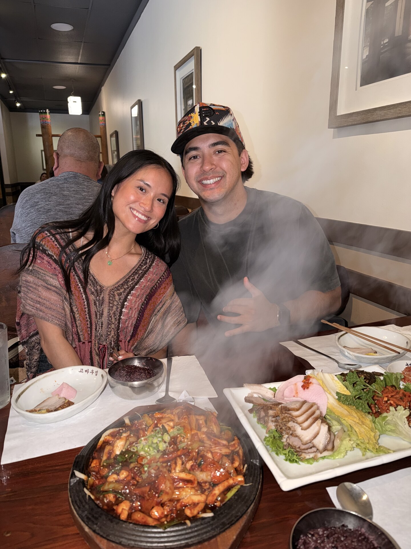 Sean and Val sharing bossam and a sizzling squid platter at Kobawoo House in LA Koreatown after the trip